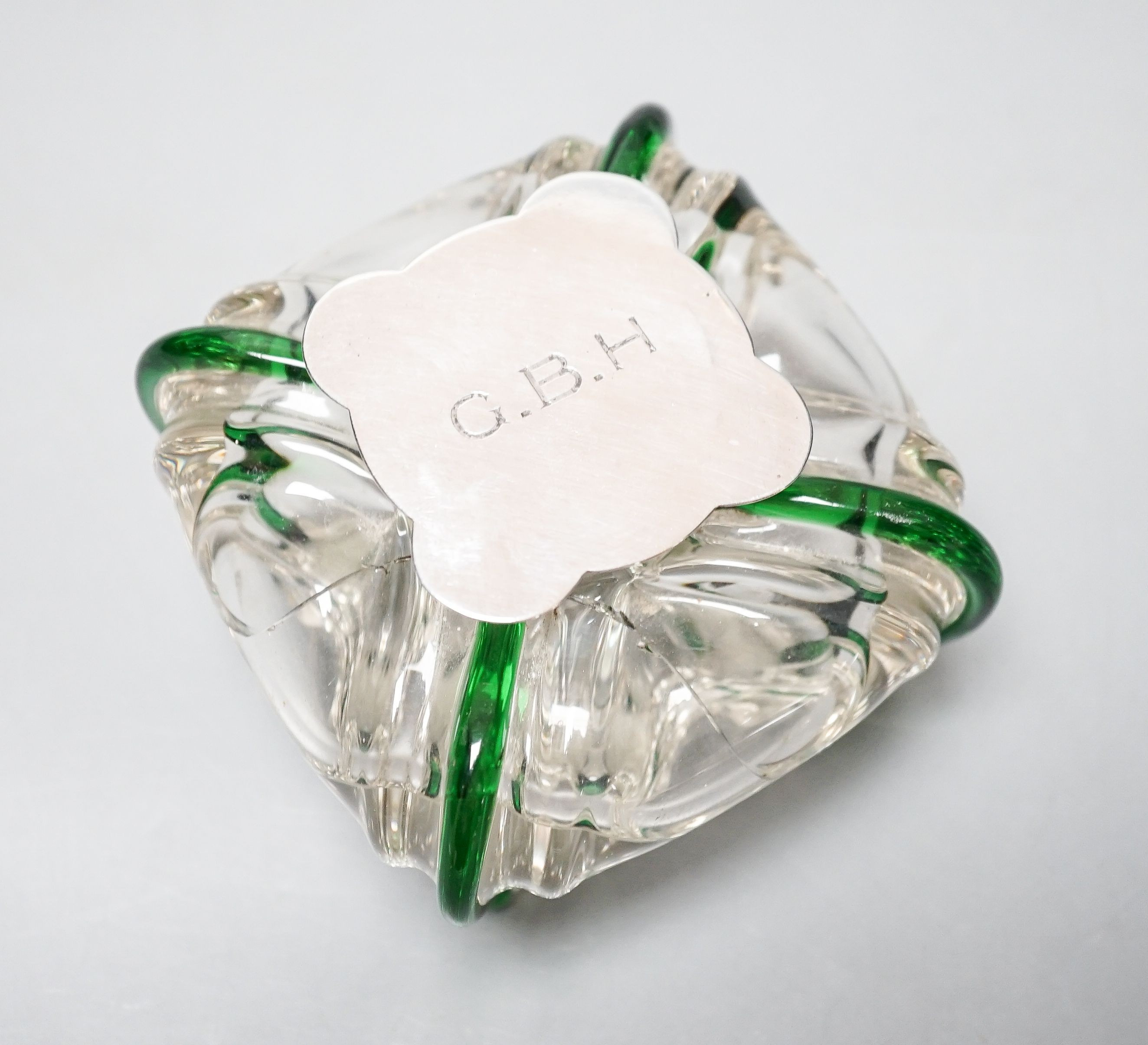 A silver-mounted green trailed glass inkwell, possibly Powell, Whitefriars. The lid initialled ‘G.B.H’ Height - 8cm